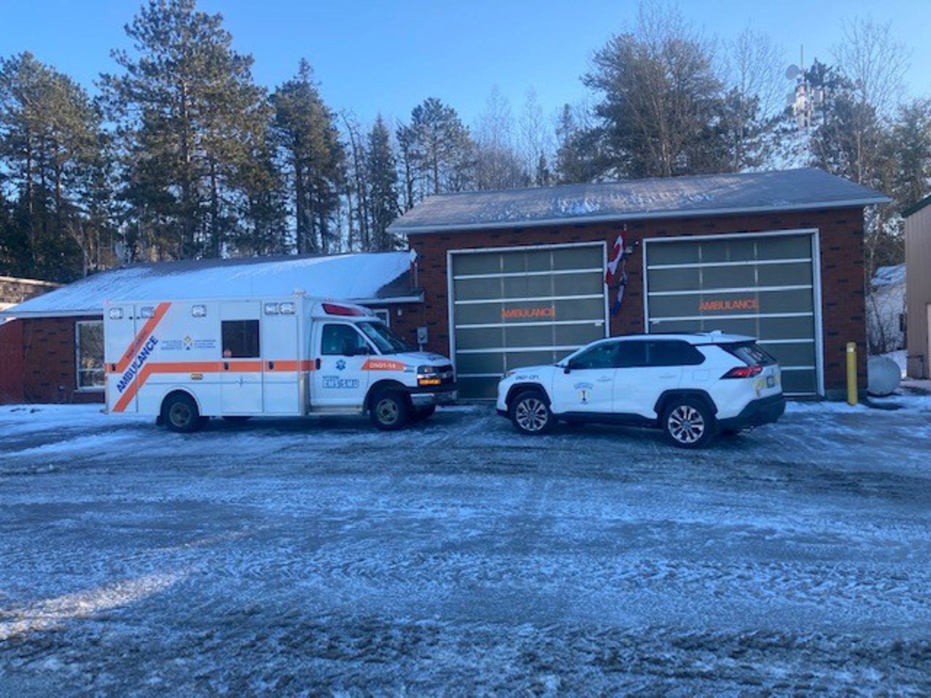 One District of Nipissing ambulance and one Community Paramedic vehicles in front of the Temagami Paramedic Services base. 